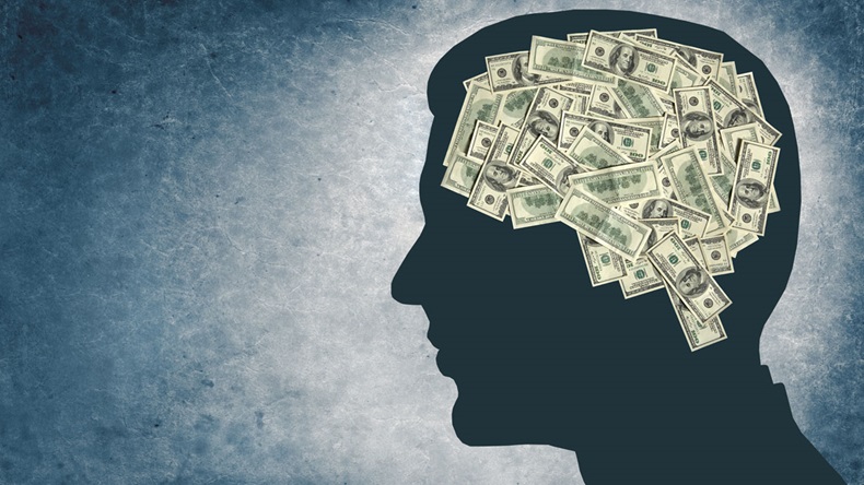 Money and your brain / outline of a man's head with the brain in the shape of money 