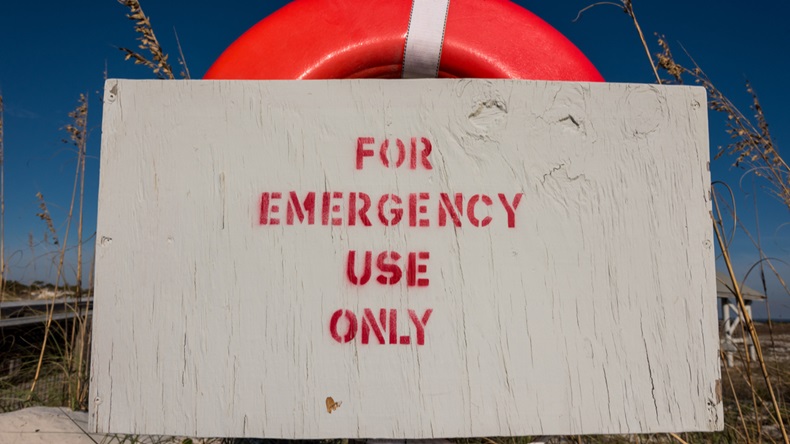 For Emergency Use Only Sign on Life Buoy with aged sign