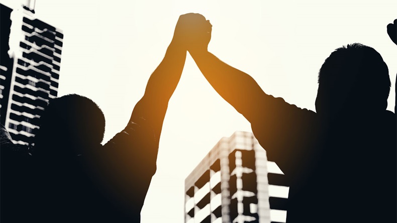 Two hand hold and join together in to sky,after everybody success something that they do,example win in game, success in business,market up volume sales.symbolizing to trust each other.