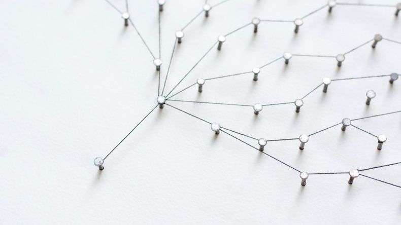 Linking entities, Network simulation, social media, Communications Network, The connection between the two networks. in paper linked together by cotton with a black yarn - Image 