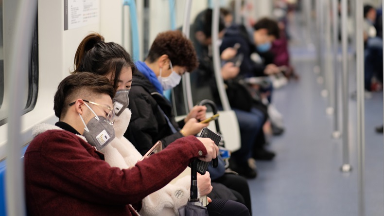 Shanghai/China-Jan.2020: New type coronavirus pneumonia in Wuhan has been spreading into many cities in China. People wearing surgical mask sitting in subway in Shanghai