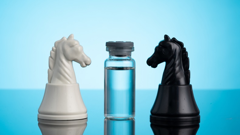 COVID-19 vaccine and chess pieces with medical concept.