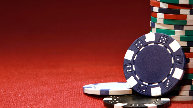Poker chips on red background