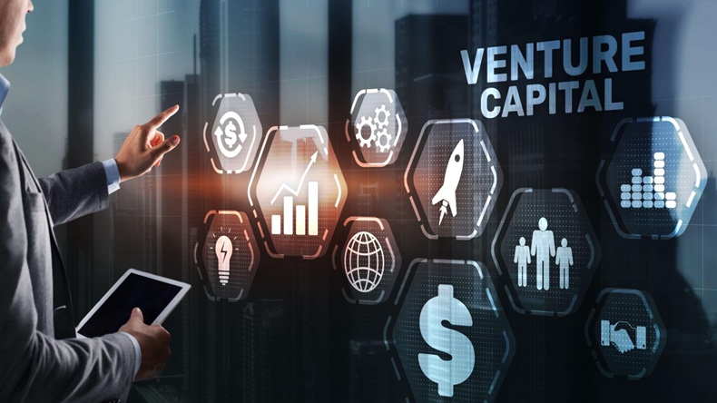 Venture capital; Businessman pressing virtual screen inscription