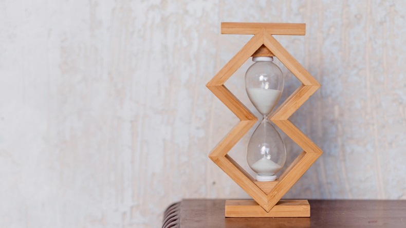 Close up of hourglass clock on a wooden floor