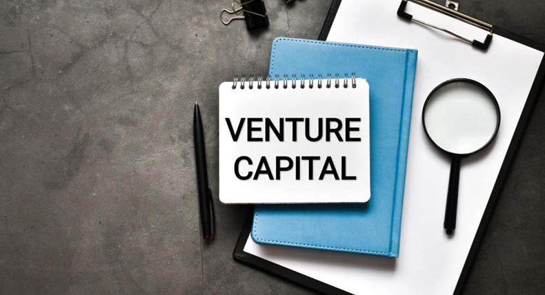 Notepad with "venture capital" written on it