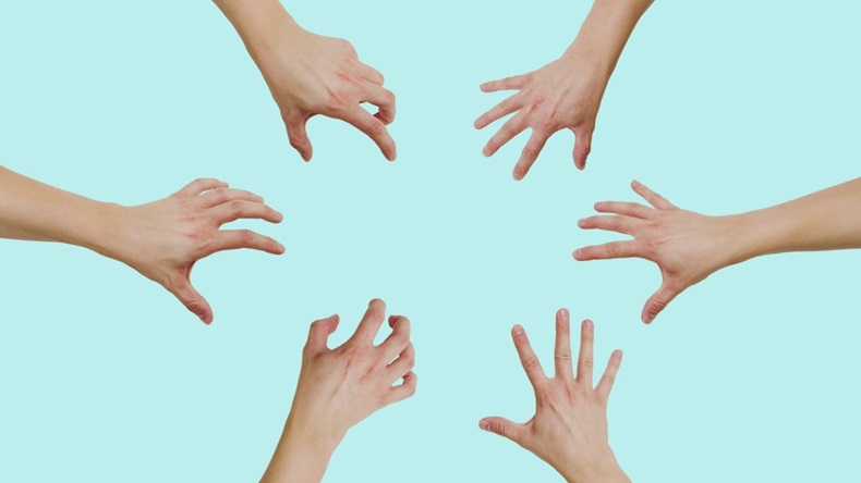 different hands grabbing the air on blue background