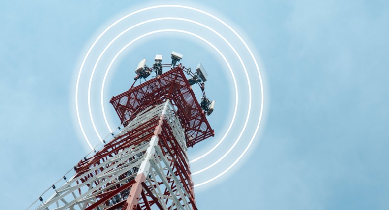 Telecommunication tower with 5G cellular network antenna on blue sky background