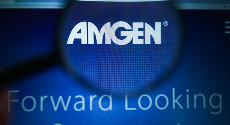 Amgen Inc logo magnified on display screen.